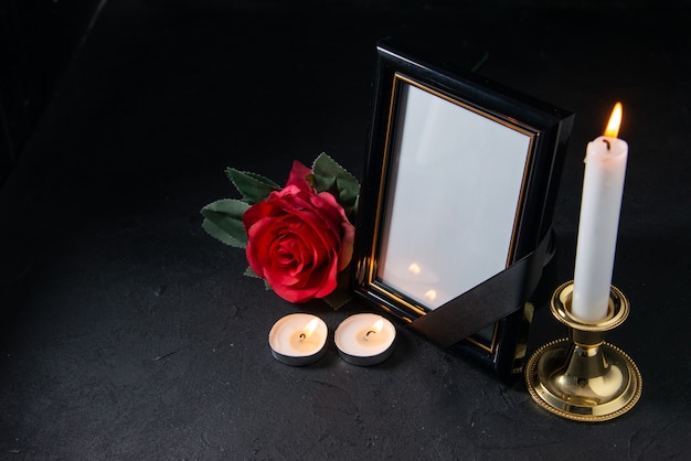 Free photo front view of picture frame with red flower on the black