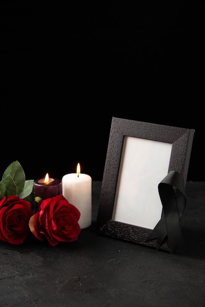 Free photo front view of picture frame with red flowers on black