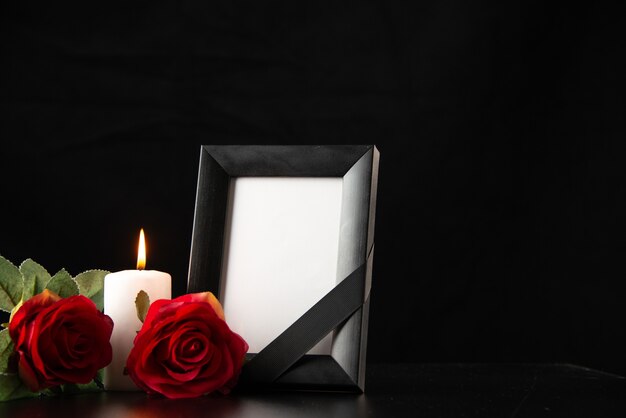 Front view of picture frame with red flowers on the black