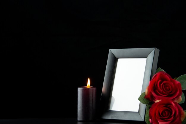 Front view of picture frame with red rose on black