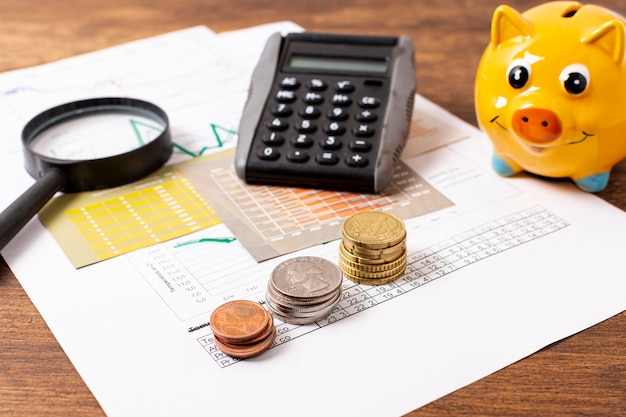 Front view of piggy bank and stationery items