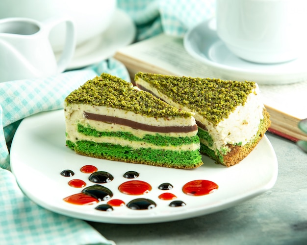 Front view pistachio cake with decor n the plate