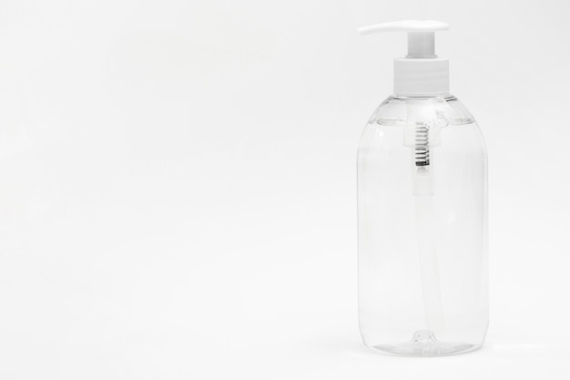 Front view of plastic bottle with liquid soap and copy space