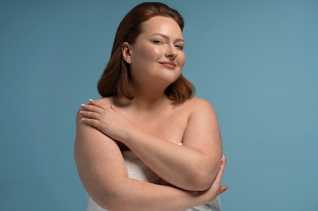 Front view plus size model posing in studio