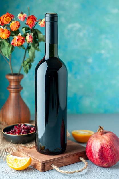 Front view pomegranate wine on blue wall drink fruit alcohol sour color bar restaurant juice wine