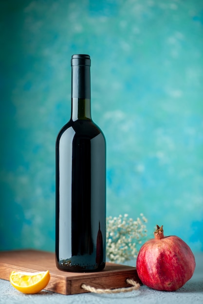 Front view pomegranate wine on blue wall drink fruit wine sour color juice bar restaurant