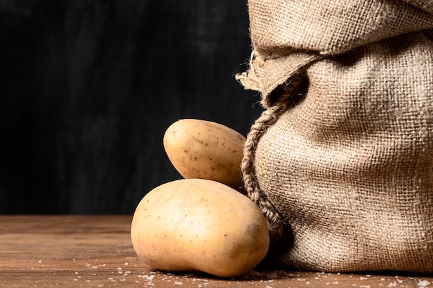 Front view of potatoes and burlap sack
