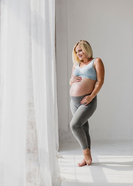 Front view pregnant woman standing