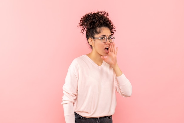 Front view of pretty female calling on pink