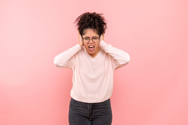 Free photo front view of pretty female screaming on pink