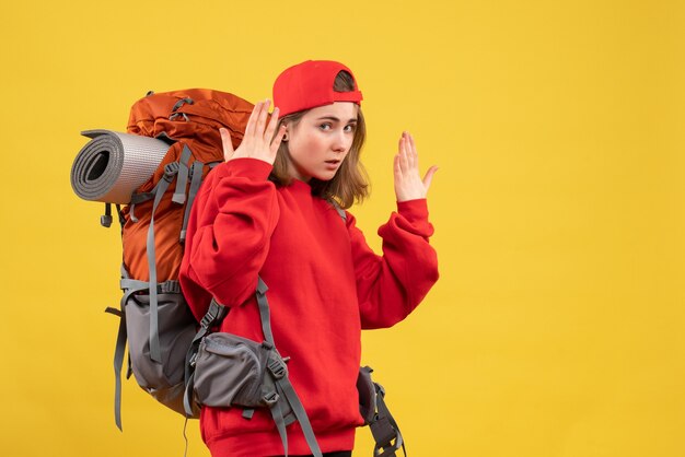 Front view pretty female traveler with backpack