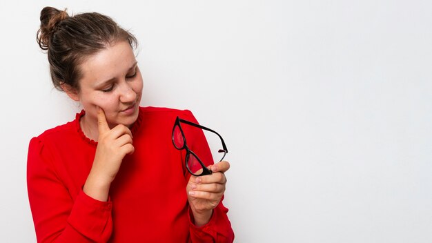 Front view pretty woman holding glasses