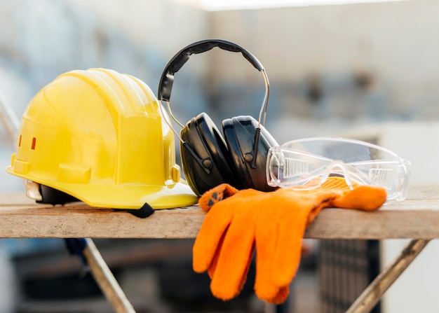 Front view of protective glasses with hard hat and headphones