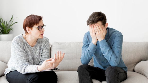 Front view of psychologist consulting a patient