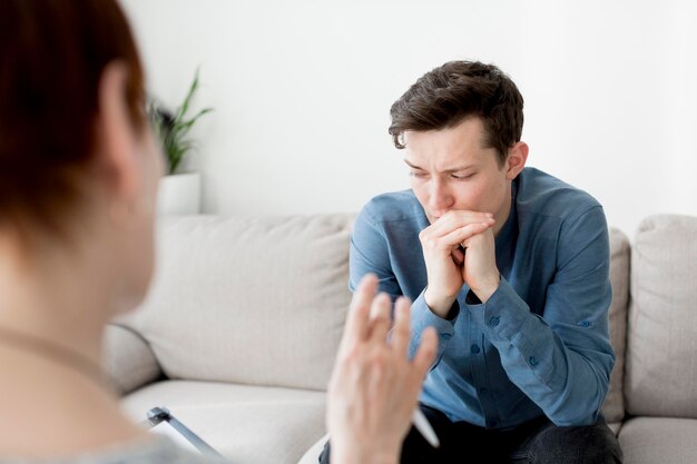 Front view of psychologist consulting a patient