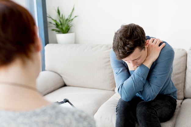 Front view of psychologist consulting a patient