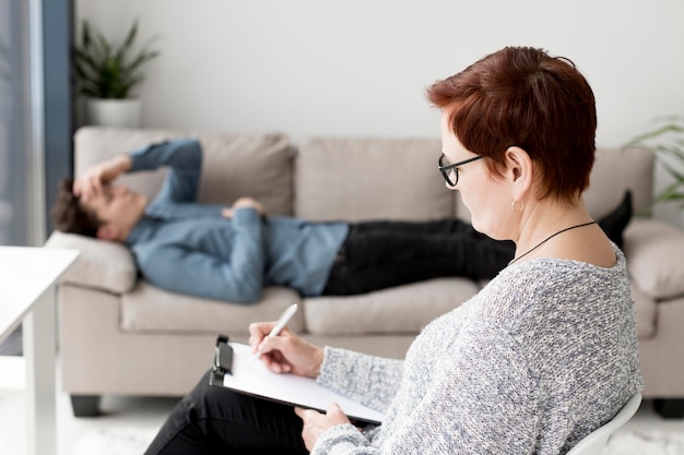 Free Photo front view of psychologist and patient