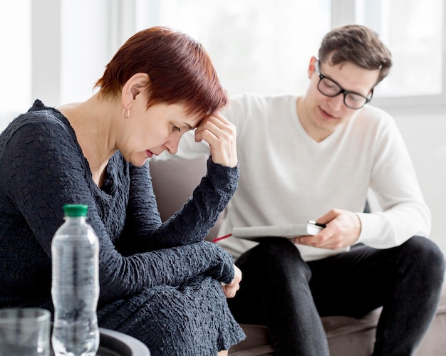 Free photo front view of psychologist and patient