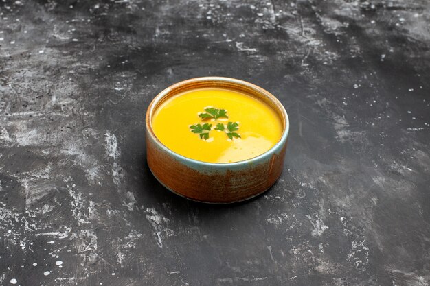 Front view pumpkin soup with greens inside plate on dark table fruit soup meal dish