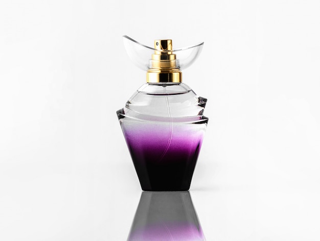 Free photo a front view purple silver bottle designed beautiful isolated on the white desk