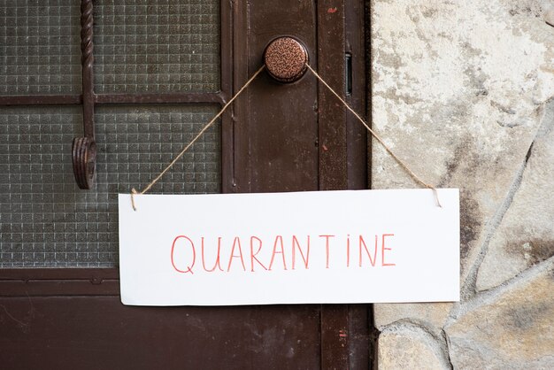 Front view quarantine sign on front door