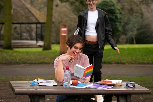 Front view queer students outdoors