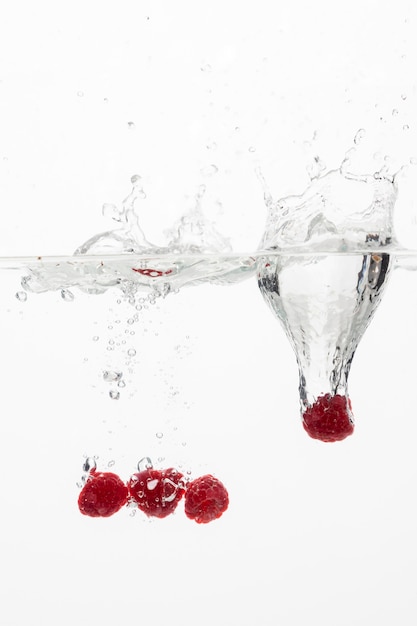 Free photo front view of raspberries in water