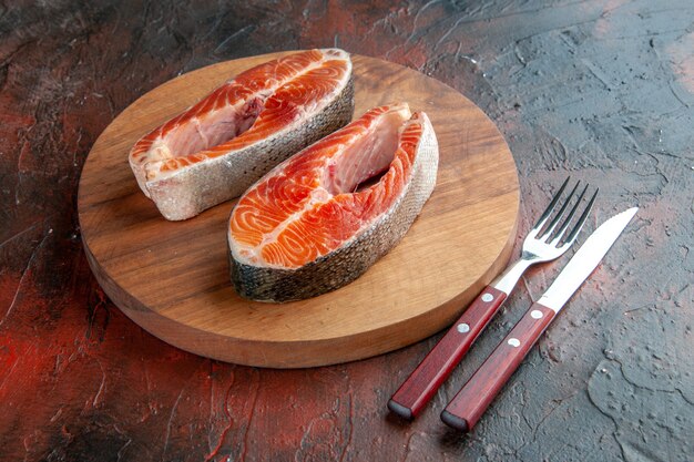 Front view raw meat slices on a dark background food meal rib dish animal barbecue