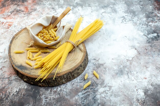 Front view raw yellow pasta on white surface