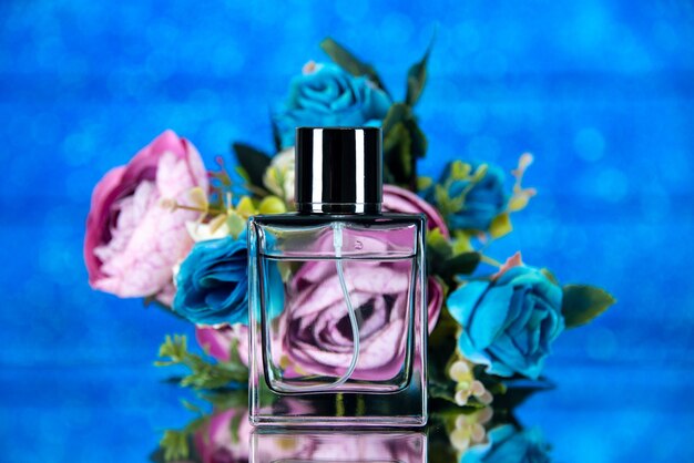 Front view rectangle perfume bottle colored flowers on blue background