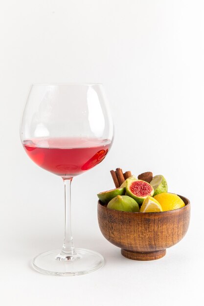 Front view red alcohol drink inside glass with fresh sweet figs on white surface alcohol drink liquor whiskey bar