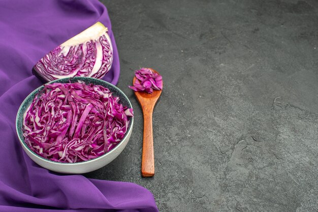 Front view red cabbage sliced inside plate on a dark table salad diet ripe health