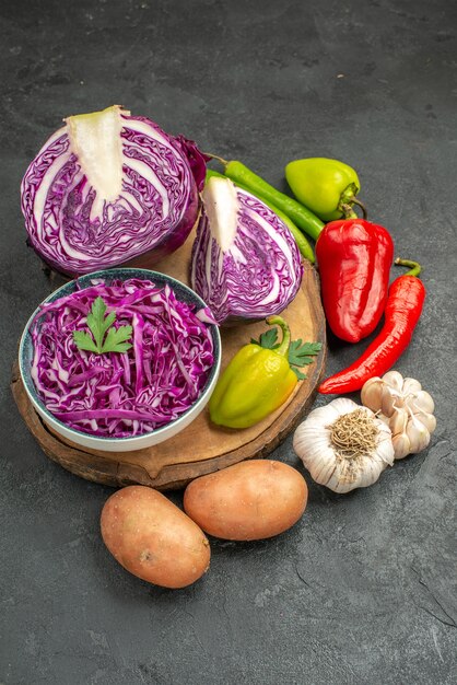 Front view red cabbage with fresh vegetables on a grey table ripe diet health salad