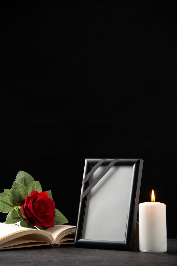 Free Photo front view of red rose with book and picture frame on black