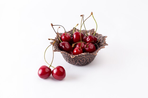 Front view red sour cherries inside plate on grey