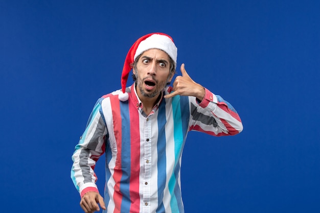 Front view regular male with red christmas cap, santa emotions holiday