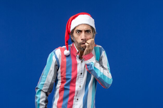 Front view regular man with scared expression, santa christmas holiday male