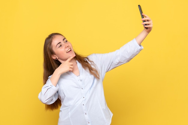 Front view of regular woman taking selfie