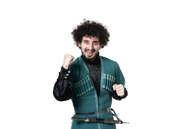 Front view of rejoicing young man in traditional azerbaijani costume on white background colours novruz ethnicity spring performer horizontal dancer concept