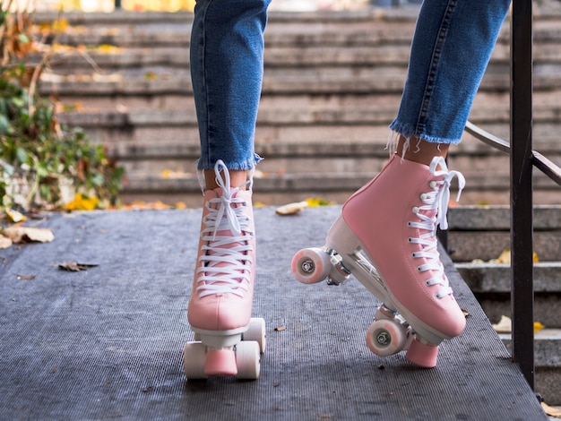 Front view of roller skates on woman in jeans