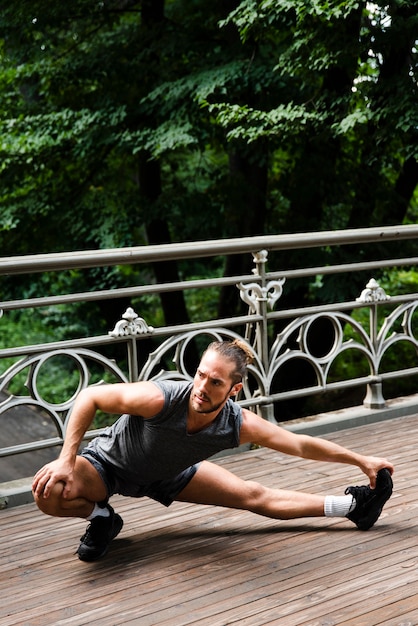 Free photo front view of runner stretching