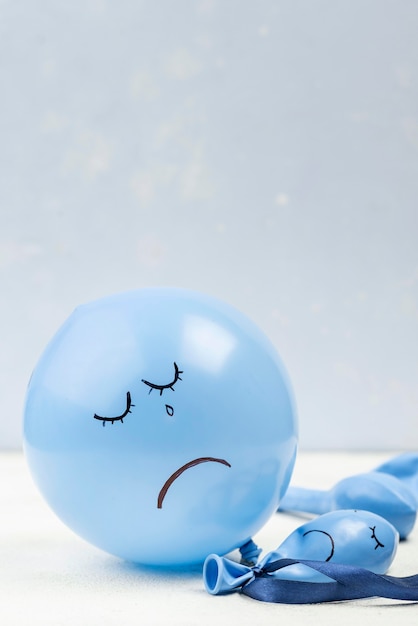 Front view of sad balloon for blue monday