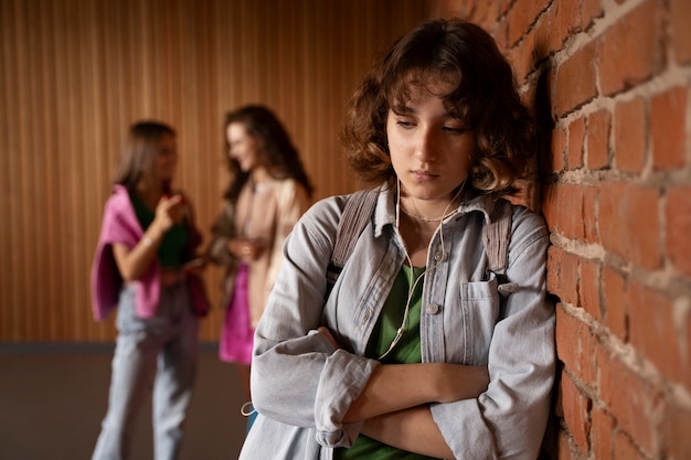 Free photo front view sad girl being bullied by girls