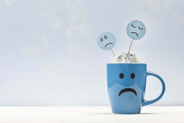 Front view of sad mug for blue monday with copy space