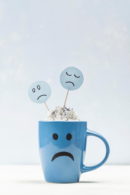 Front view of sad mug with copy space for blue monday