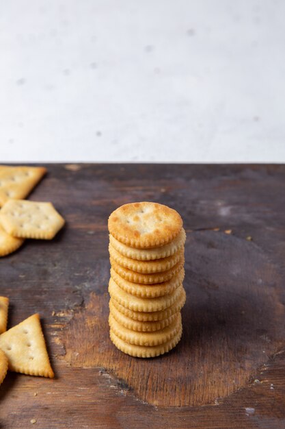 Front view salted tasty crisps on wooden