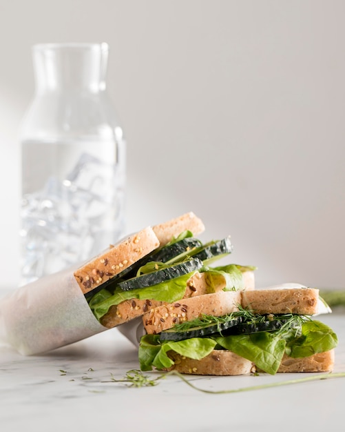 Front view of sandwiches with greens and cucumber