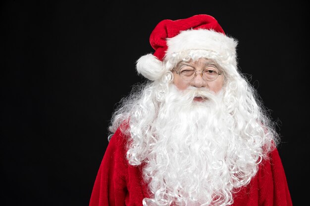 Front view santa claus in classic red suit with white beard