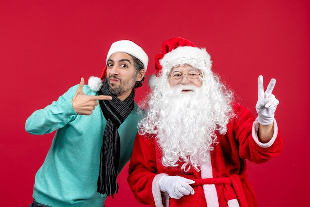 Front view santa claus with young male just standing
