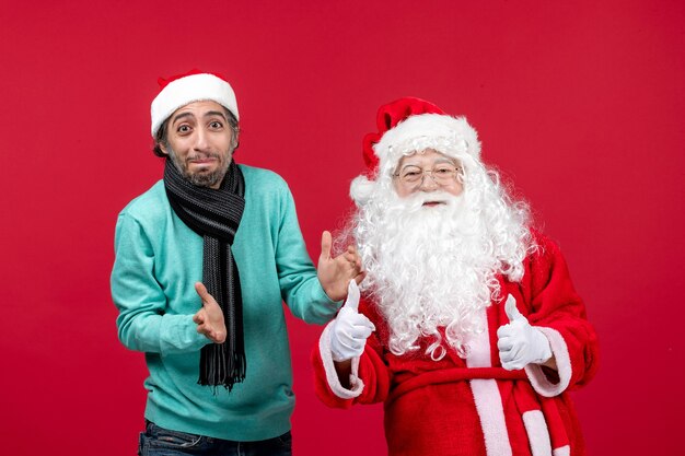 Front view santa claus with young male just standing